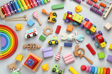 Wall Mural - Different children's toys on light grey background, flat lay