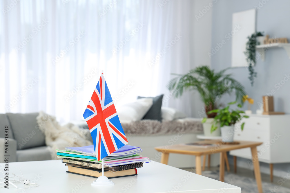 UK flag with books on table in office