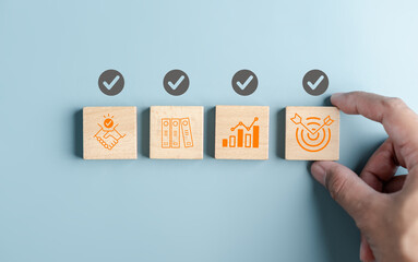 Aufkleber - Hand holding wooden block with Quality Assurance or QA and Quality Control or QC and improvement. Standardization, certification. Compliance to regulations service and standards...
