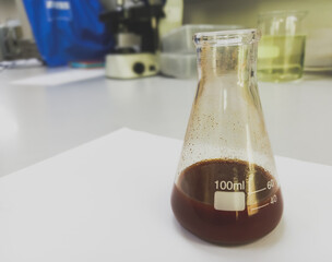 Poster - Hematoxylin reagent after filtering for histology slide staining. Medical laboratory testing concept.