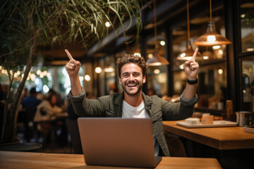 Wall Mural - Laughing Mel freelancer, online blogger working on laptop computer in coffee shop.