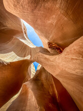 An Arch Is Nestled In A Red Rock Slot Canyon Near Kanab, Utah