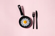 © Cavan Images - art print. breakfast fried eggs in pan. cover. cooking. minimalism