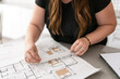 © Cavan Images - An interior designer measuring for a home renovation project