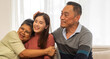 © Art_Photo - Portrait enjoy happy smiling love asian family.Senior mature father hug with elderly mother and young adult woman play laughing and having fun together at home.insurance concept