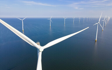 Panoramic view of wind turbines in the ocean