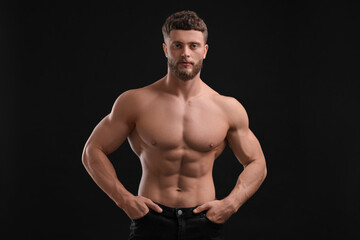 Canvas Print - Handsome muscular man on black background. Sexy body