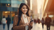 © Designcy Studio - Young busy happy Asian business woman office professional holding cellphone in hands walking on big city urban street making corporate business call, talking on the cellular phone. Authentic shot