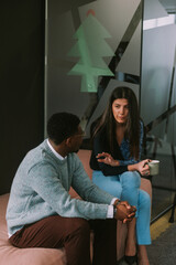 Wall Mural - Young business colleagues having a conversation