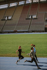 Wall Mural - People running at the stadium