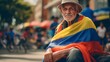 Colombian old man with colombian flag on him on the street
