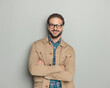 © Viorel Sima - handsome happy man with glasses smiling while crossing arms