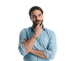 © Viorel Sima - thoughtful casual man in denim shirt folding arms and thinking