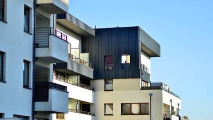 Wall Mural - Modern apartment building in a residential area of ​​a city. Contemporary residential building exterior in the daylight. 