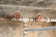 Valves on Pipes of Water on house roof . Metal Pipe connections, Metal Pipe fitting, Metal Coupling ,Metal pipe valve