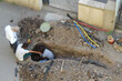 Electrician working in India, Electrician digging hole in ground and repairing underground electricity line