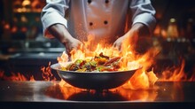 Close-up Professional Chef Hands Cook Food With Fire In Kitchen At Restaurant.
