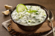cucumber raita yogurt served in dish isolated on food table top view of middle east spices