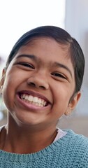 Poster - Selfie, face and laughing with a girl child closeup in the living room of her home for playful recording. Portrait, smile and happy young indian kid in her house for a video, movie or film for youth