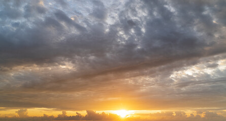 Wall Mural - abstract amazing scene of stuning colorful sunset or sunrise with clouds background in nature and tr