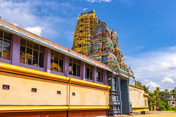 Many painted figures of gods on Gopura of Sri Muthumariamman Temple