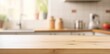 © iridescentstreet - Modern kitchen with blurred background, bright wooden countertop, empty space for product display