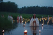© Rytis - Saint John's Festival (Jonines, Saint John's Day, Ivana kupala) midsummer pagan folk festival illustration. Celebrated on June 24. Beautiful woman in lake portrait. Generative AI