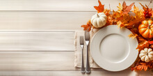 Thanksgiving Fall Place Setting With Cutlery And Fall Leaf Arrangement, Top View, Flat Lay. Autumn Place Setting With Fall Leaves, Napkin And Pumpkins.