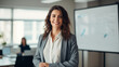 © Visual Studio - Female employee or supervisor inside office giving a business presentation in front of whiteboard