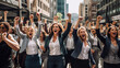 © Artofinnovation - Group of business woman in the streets happy and celebrating with their fists in the air, concept of female empowerment in the workforce