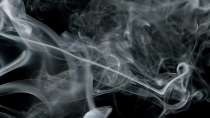 Wall Mural - horizontal smoke burning and swirling in soft ethereal shapes. real smoke on black background.