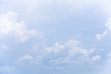 Wall Mural - blue sky background and white clouds soft focus, and copy space horizontal shape.