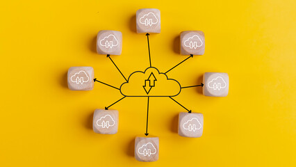 Cloud computing concept with wooden cubes on a yellow background. Top view. Cloud technology. Data storage. Networking and Internet service concept..