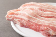 Raw pork belly on a plate