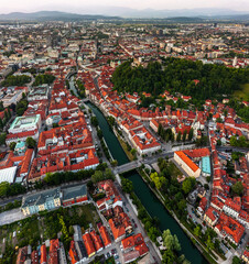 Wall Mural - Ljubljana, Slovenia - Aerial panoramic view of Ljubljana on a summer afternoon with Franciscan Church of the Annunciation, Ljubljana Castle, Ljubljana Cathedral and skyline of the capital of Slovenia