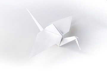 Wall Mural - paper crane origami isolated on a white background