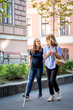 © sepy - Visually impaired woman walking with female friend on the city street