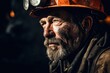 A picture of a man with a beard wearing a hard hat. This image can be used to represent construction, engineering, or safety.