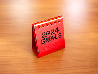 Poster - start a new year 2024 banner background. handwritten text, goals and 2024 numbers year with target i