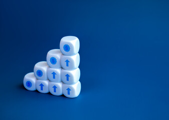 Poster - Money cash icon and rise up arrow on white cube blocks graph steps  isolated on blue background with copy space. Business growth process, profit, sales, passive income, economic improvement concepts.