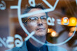 © Westend61 - Smiling mature businessman planning strategy seen through glass in office