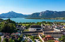Austria, Upper Austria, Mondsee, Drone View Of Mondsee Abbey With Lake In Background