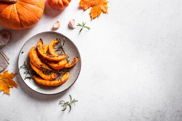 Wall Mural - Roasted pumpkin slices with garlic and herbs