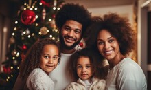 Happy African American Family Hugging Near Christmas Tree At Home