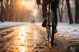 close up man riding a bicycle on a road in a winter snow