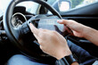 © ponsulak - busines man Sitting in the Car and Using digital tablet.