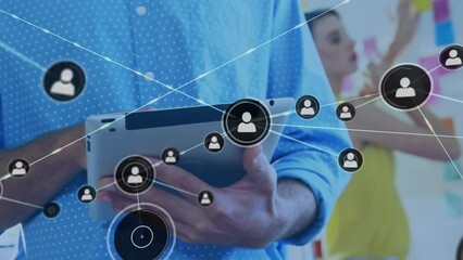 Poster - Animation of network of profile icons against mid section of a man using digital tablet at office