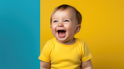 Poster - Small child laughing on a yellow background