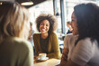 © Jasmina - Happy smiling female friends sitting in a café laughing and talking during a lunch break