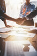 © Daenin - business partner handshake concept Colleagues shaking hands Successful deal after a great meeting. Blurred background.